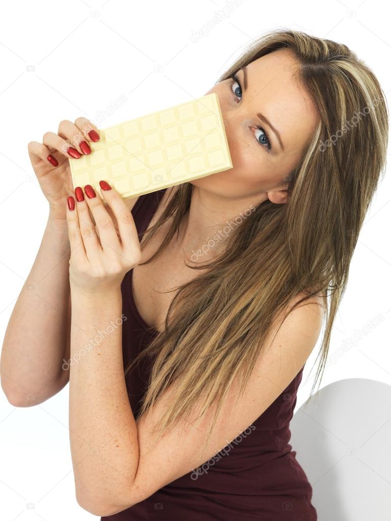 Young Woman Holding a White Chocolate Bar