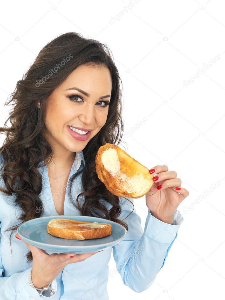 Young Woman Eating Hot Buttered Toast