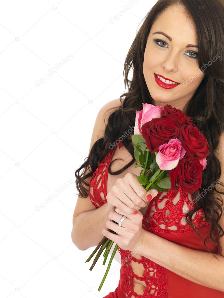 Sexy Young Woman Wearing Red Lingerie and Holding Red Roses