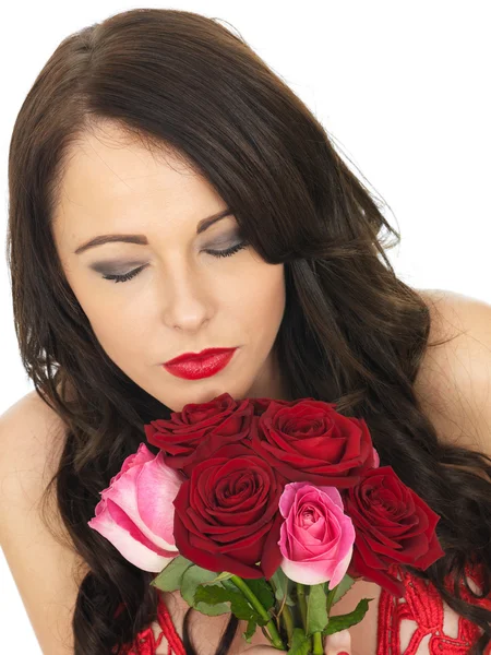 Sexy Young Woman Wearing Red Lingerie and Holding Red Roses — Stock Photo, Image