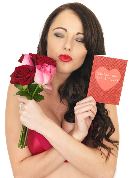 Sexy Young Woman Wearing Red Lingerie and Holding Red Roses — Stock Photo, Image