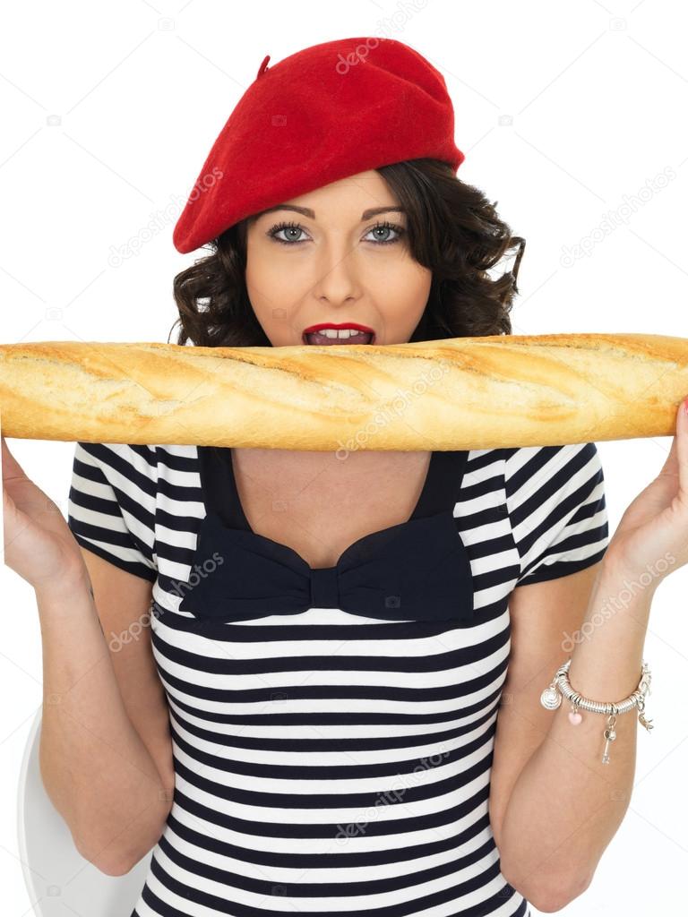 Attractive Young Woman Eating a French Stick Bread Loaf