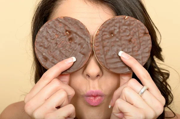 Young Woman Eating Chocolate Covered Rice Cakes — Stock Photo, Image