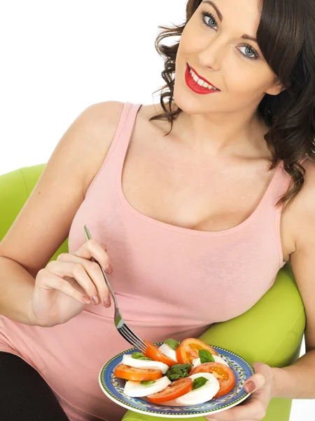 Young Woman Eating a Mozzarella Cheese and Tomato Salad — Stock Photo, Image