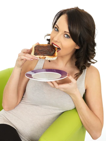 Young Woman Holding Toast Spread with Marmite — Stock Photo, Image