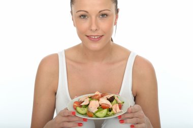 Healthy Young Woman Holding a Plate of Salmon Salad