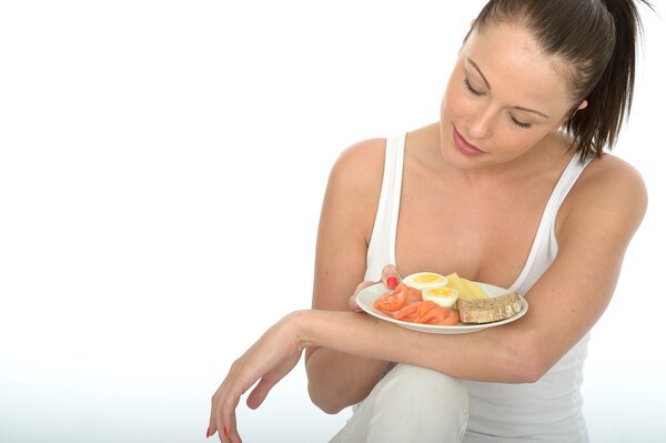 Healthy Young Woman Holding A Plate Of A Typical Healthy Scandinavian Breakfast Buffet