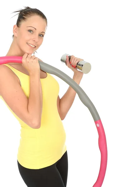 Gesunde junge Frau mit stummer Glocke und Hula-Hoop-Reifen — Stockfoto