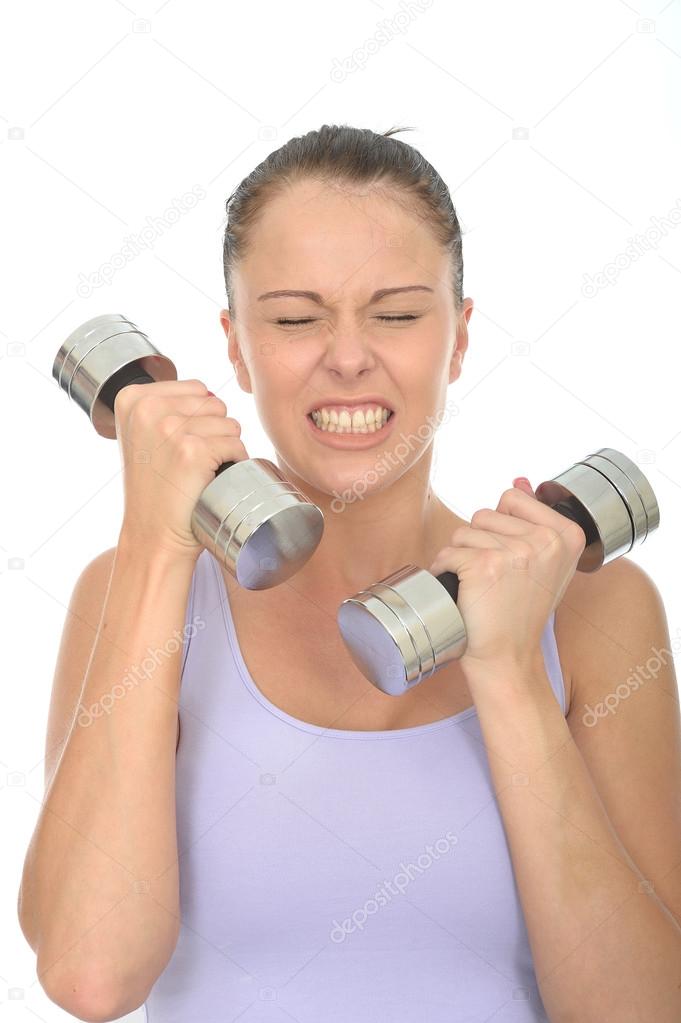 Healthy Young Determined Woman Training With Dumbbell Weights