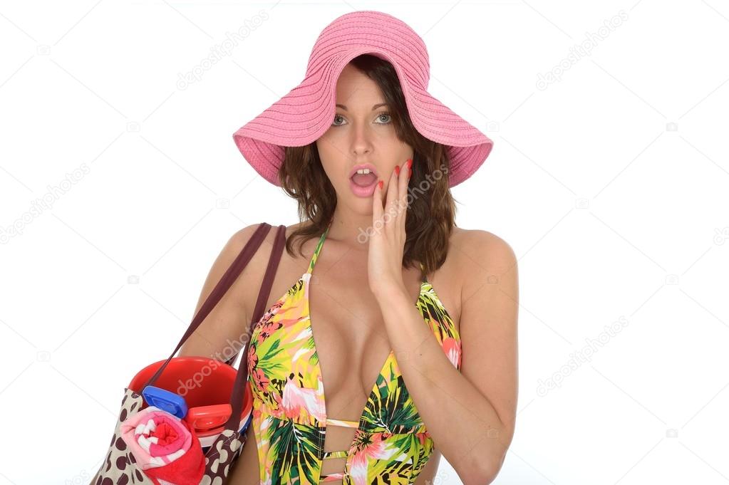 Young Woman Wearing a Swim Suit and a Pink Straw Hat on Holiday