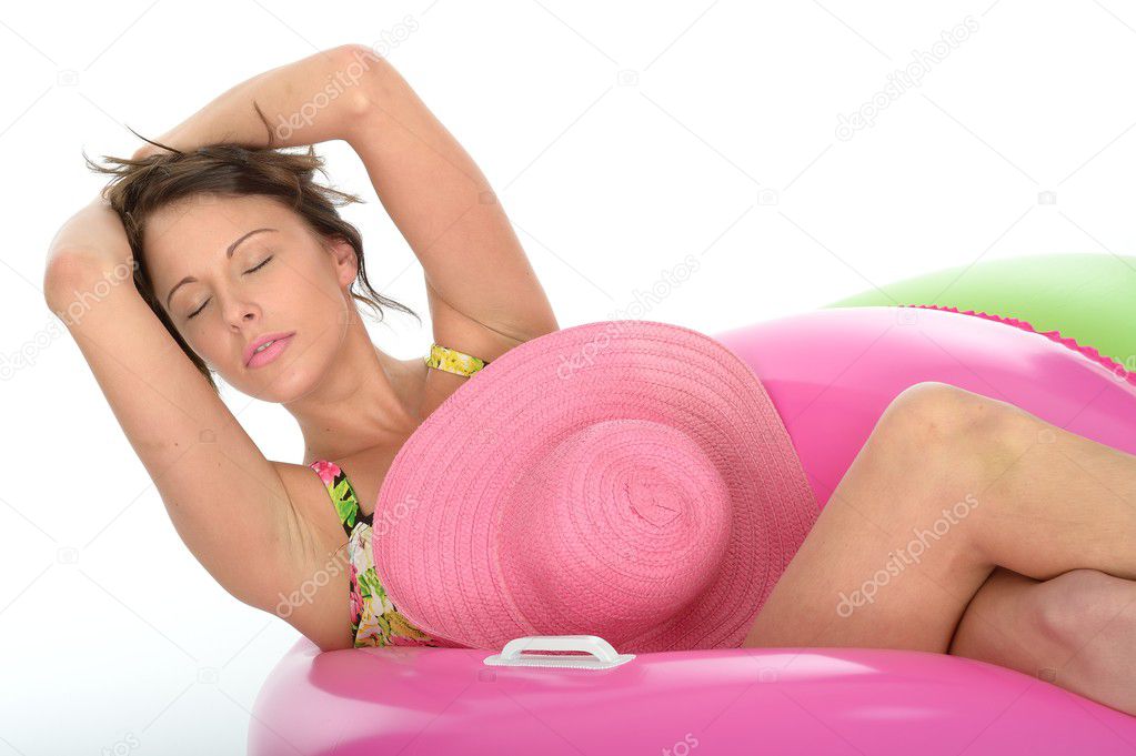 Attractive Young Woman Sitting in Rubber Rings Wearing a Swimsui