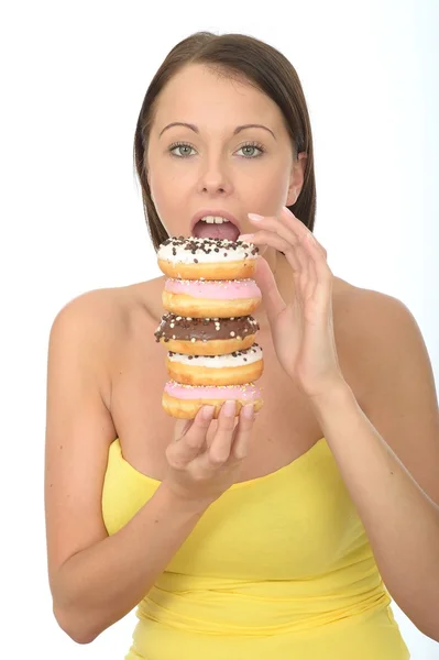 Attractive Young Woman Holding a Pile of Iced donuts — Stock Photo, Image