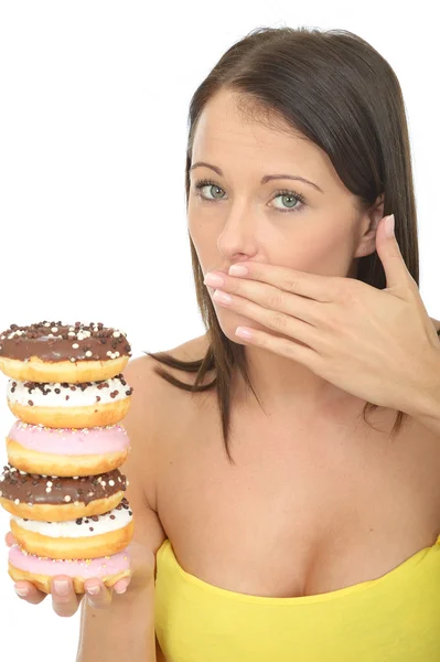Attractive Young Woman Holding a Pile of Iced donuts — Stock Photo, Image