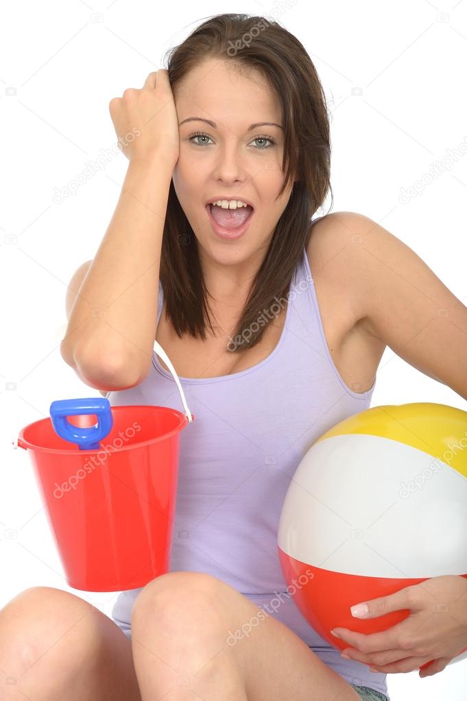 Portrait of a Happy Excited Young Woman Holding a Bucket and Spade