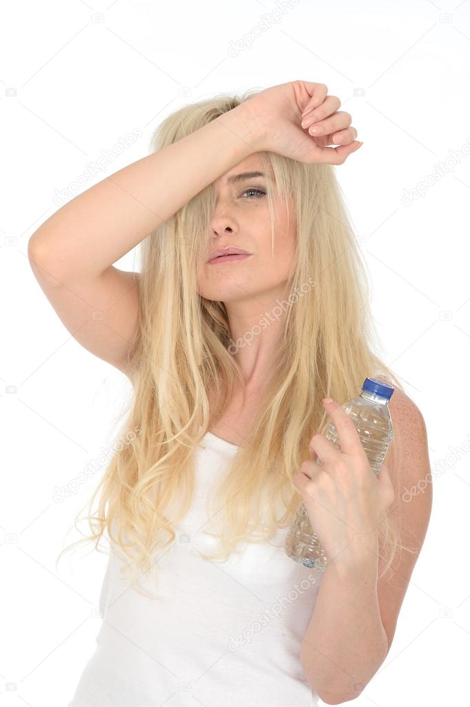 Fit Healthy Young Blonde Woman Holding a Bottle of Mineral Water