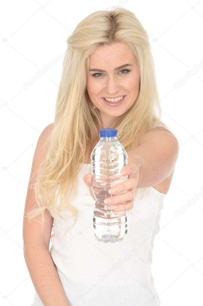 Fit Healthy Young Blonde Woman Holding a Bottle of Mineral Water