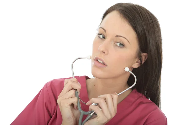 Portrait Of A Beautiful Young Female Doctor Putting On A Stethoscope — Stock Photo, Image