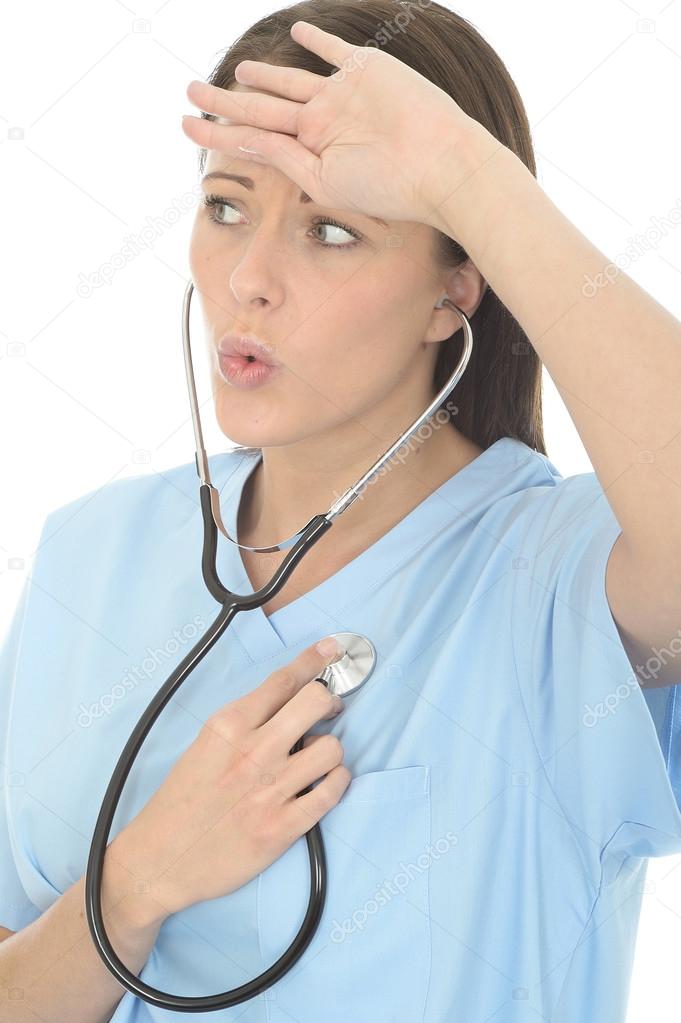 Beautiful Young Female Doctor Listneing To Her Own Heart