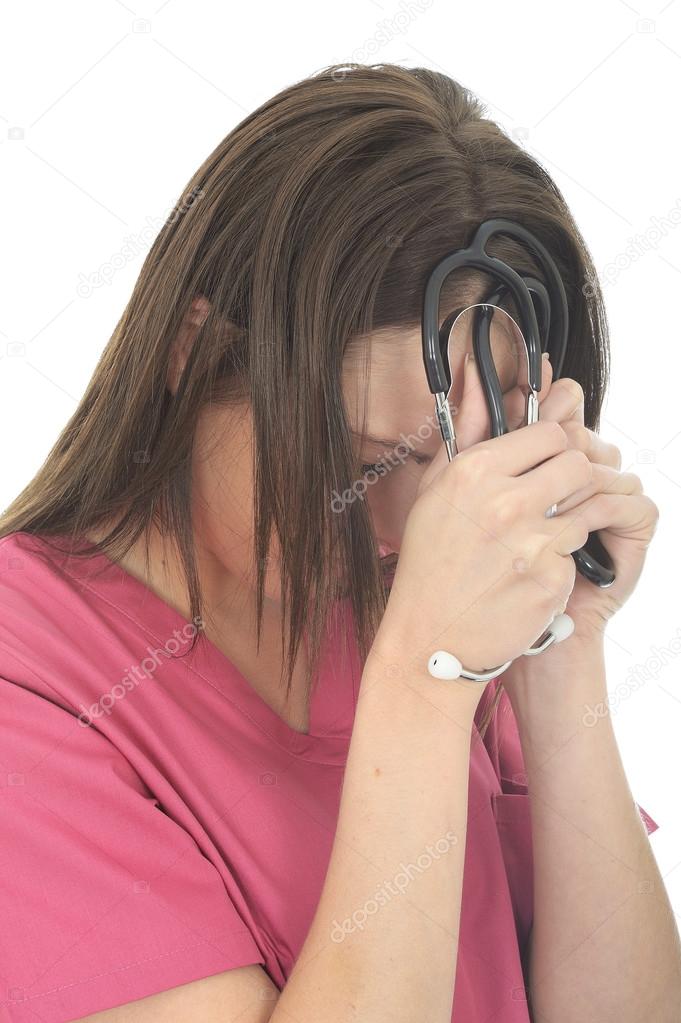 Stressed And Upset Young Female Doctor Resting Her Head