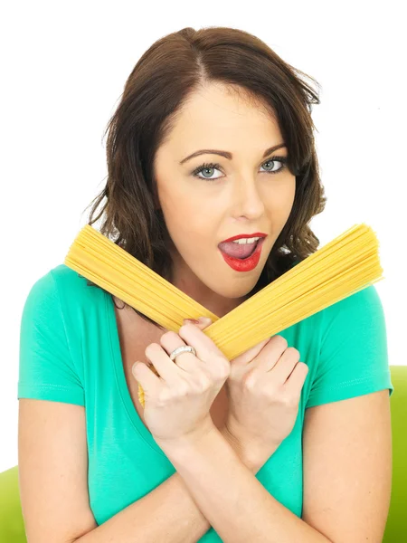 Attractive Young Woman In Her Twenties Holding Handfulls of Dried Spaghetti — Stock Photo, Image