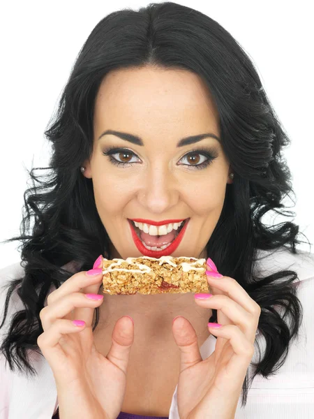 Young Woman Eating a Breakfast Cereal Bar — Stock Photo, Image