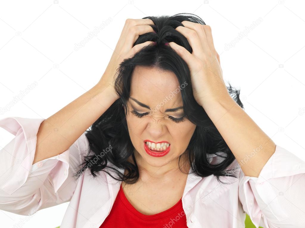 Portrait of a Frustrated Beautiful Young Hispanic Woman Pulling Her Hair