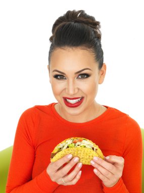 Beautiful Young Hispanic Woman With Crispy Chilli Beef Tacos