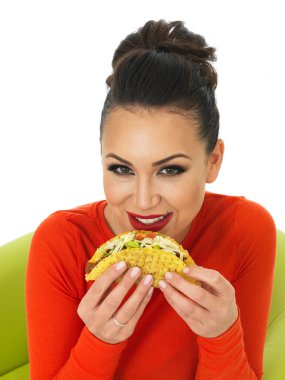 Beautiful Young Hispanic Woman With Crispy Chilli Beef Tacos