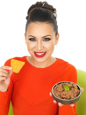 Beautiful Young Hispanic Woman With Mexican Style Refried Beans