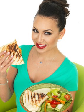 Beautiful Attractive Young Hispanic Woman Holding A Plate Of Mexican Quesadula