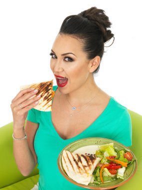 Beautiful Attractive Young Hispanic Woman Holding A Plate Of Mexican Quesadula