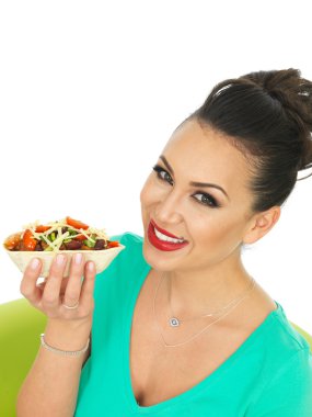 Attractive Young Hispanic Woman With Soft Chilli Beef Taco with Salad