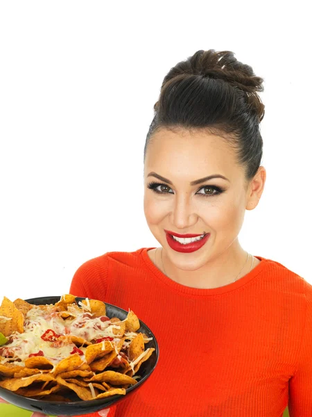 Beautiful Young Hispanic Woman With a Plate of Cheesy Nachos and Spicy Salsa Sauce — Stok fotoğraf
