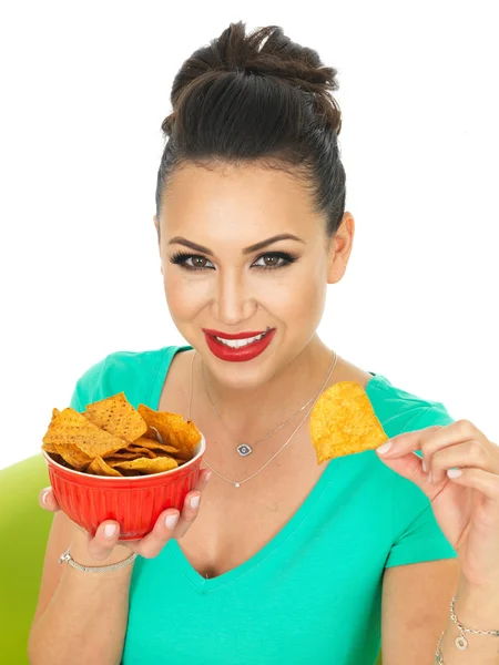 Beautiful Attractive Young Hispanic Woman Holding A Bowl Of Spicy Tortilla Chips — Stockfoto