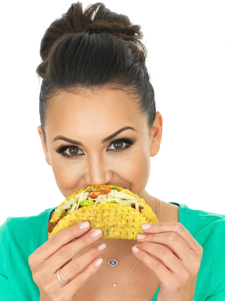 Beautiful Young Hispanic Woman With Crispy Chilli Beef Tacos with Salad and Grated Cheese