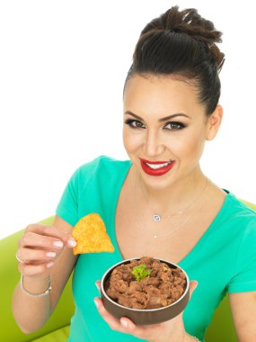 Beautiful Young Attractive Hispanic Woman With Mexican Style Refried Spicy Beans