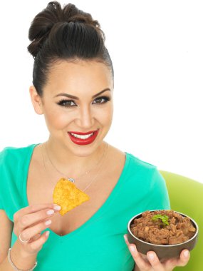 Beautiful Young Attractive Hispanic Woman With Mexican Style Refried Spicy Beans