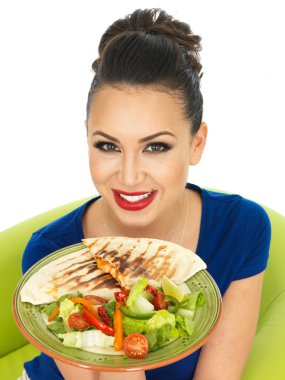 Beautiful Young Attractive Hispanic Woman Holding A Plate of Mexican Quesadula