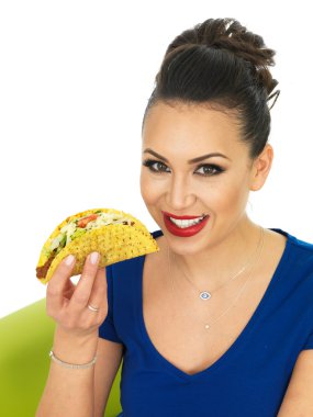 Beautiful Attractive Young Hispanic Woman With A Crispy Chilli Beef Taco With Salad