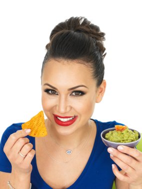 Beautiful Attractive Young Hispanic Woman Holding A Small Bowl  Of Homemade Guacamole
