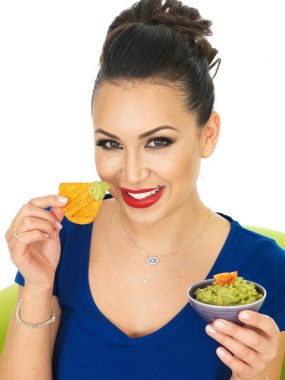 Beautiful Attractive Young Hispanic Woman Holding A Small Bowl  Of Homemade Guacamole