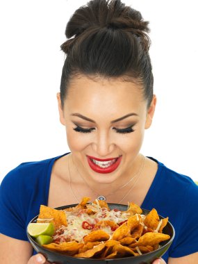 Beautiful Attractive Young Hispanic Woman Holding A Dish of Nachoes