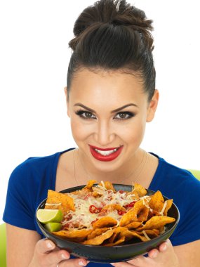 Beautiful Attractive Young Hispanic Woman Holding A Dish of Nachoes