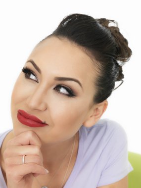 Portrait Of A Very Thoughtful Beautiful Hispanic Young Woman Contemplating and Thoughtful