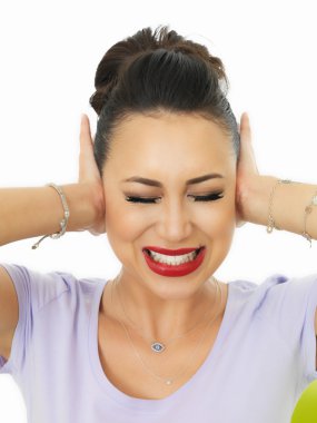 Portrait Of A Beautiful Young Hispanic Woman Covering Her Ears