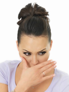 Portrait Of A Nervous Shy Beautiful Young Hispanic Woman Covering Her Mouth