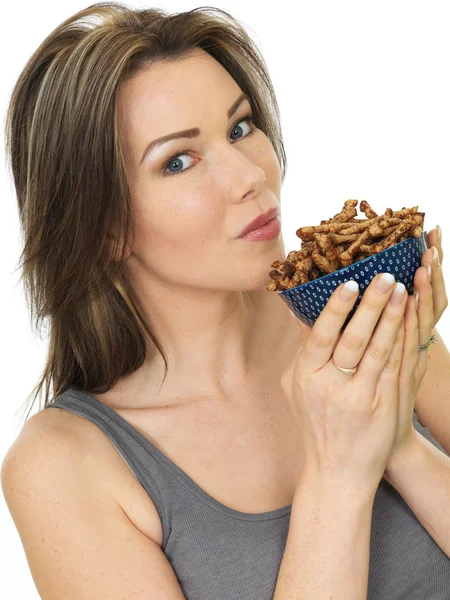 Attractive Young Woman Holding a Bowl of Savory Twigglets Finger Food — Stock Photo, Image