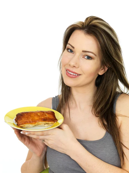 Attractive Young Woman Holding A Large Sausage Roll on a Plate — Stock Photo, Image