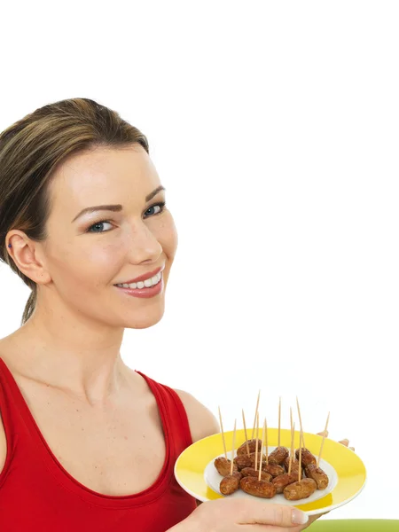 Attractive Young Woman Holding A Plate of Cocktail Sausages — Stock Photo, Image