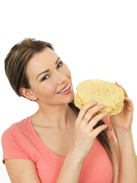 Attractive Young Woman Holding A Pile Of Indian Style Poppadoms — Stock Photo, Image